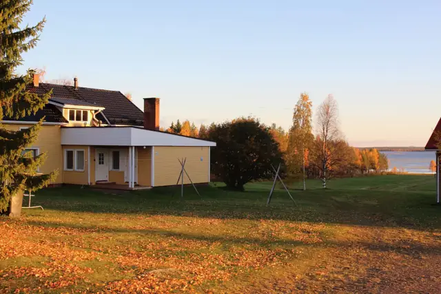 The house in autumn colours at sunset